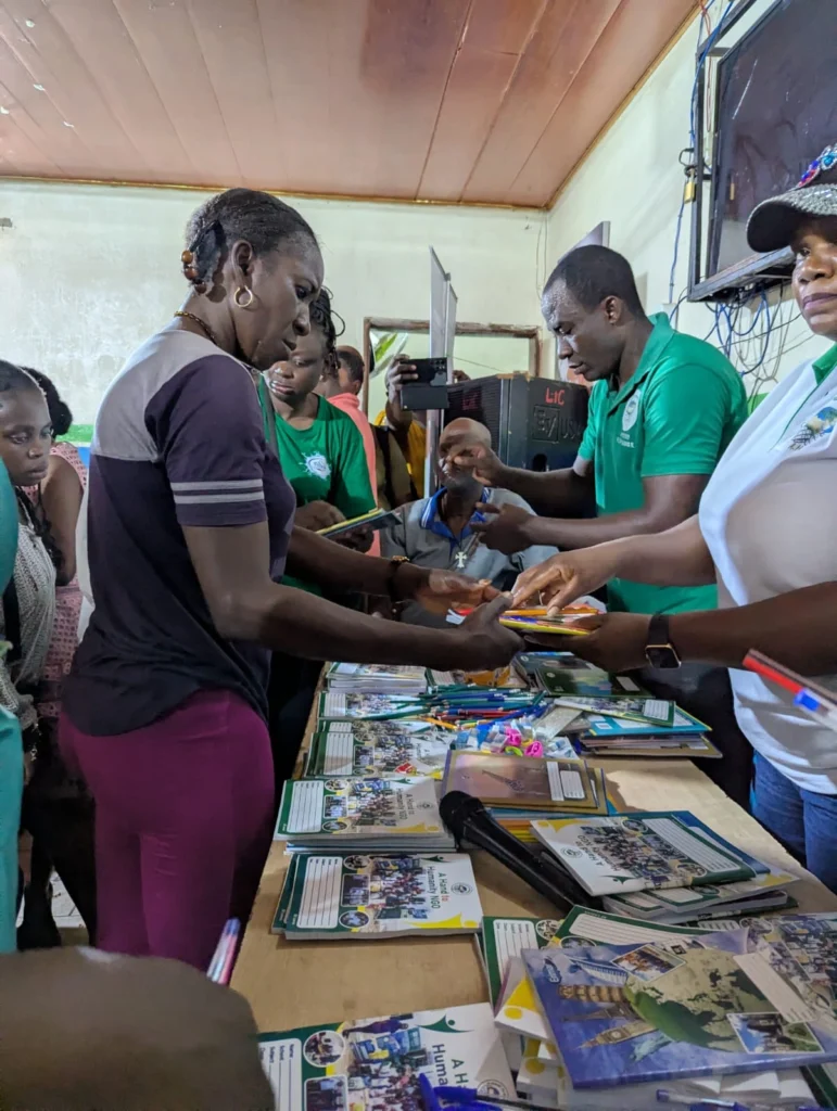 A Hand to Humanity team delivering school supplies when you sponsor a child in Cameroon