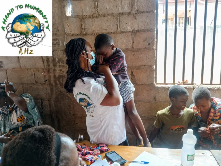 International volunteer playing with children during a volunteer orphanage Cameroon 2026 outreach visit