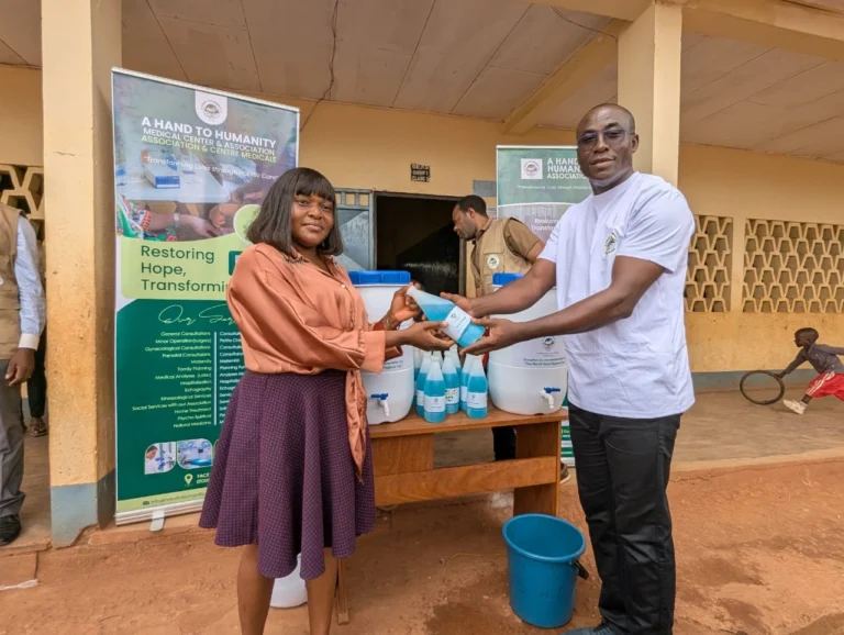 Co-branded AH2 school kits distributed in Yaounde with partner logo — NGO partnership Cameroon business impact 2026
